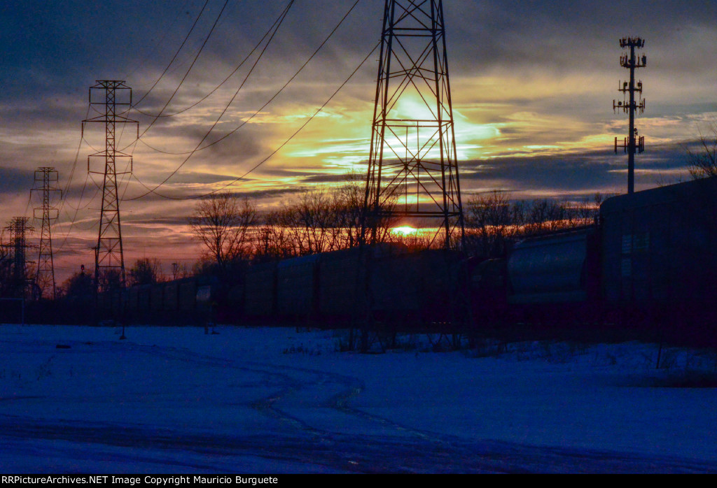 Train passing by at the sunset